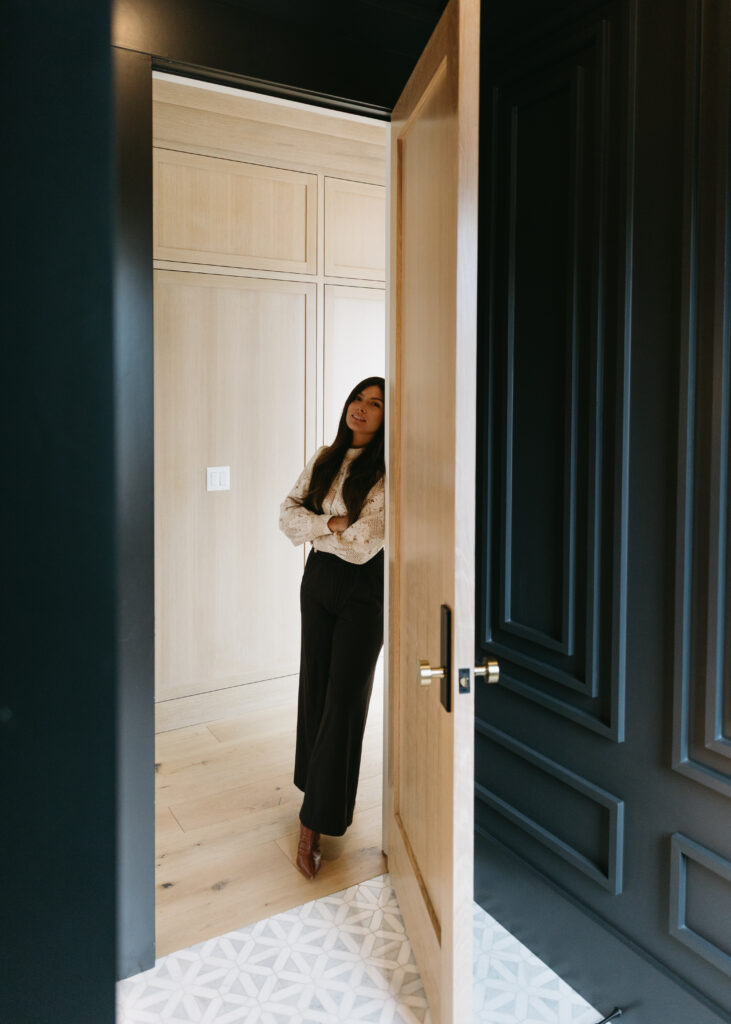 White oak interior door to moody powder bathroom