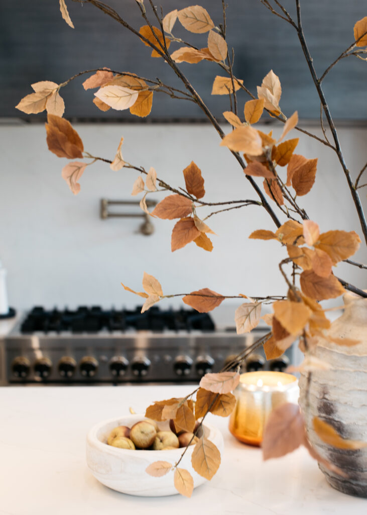 Fall decorating with faux stems and scented candles.